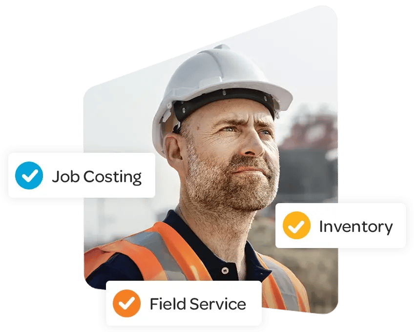 Man wearing a hard hat and orange safety vest looking upwards