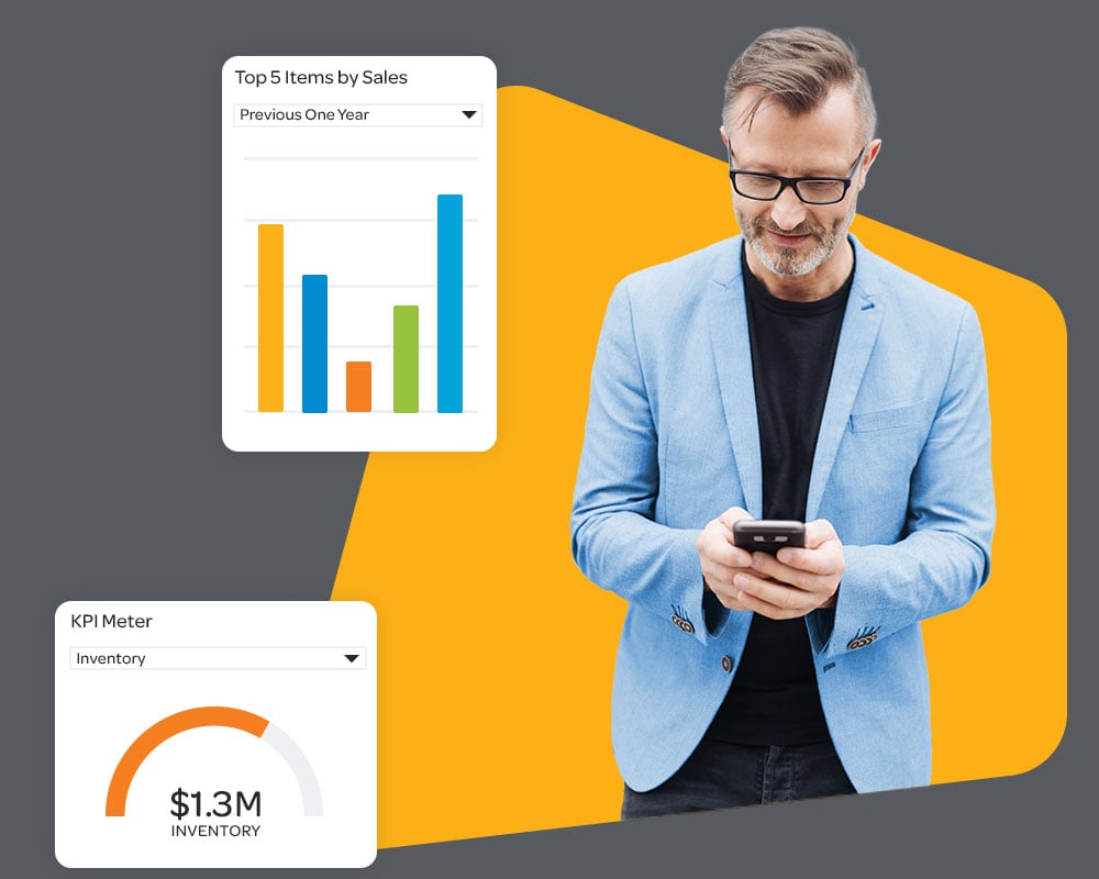 Businessman in a suit checking his phone with an orange background