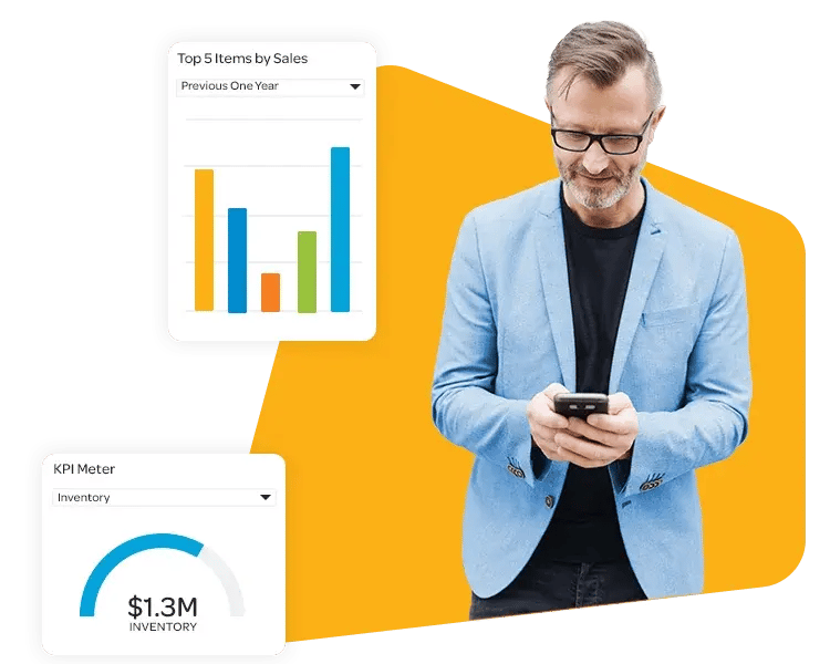 Businessman in a suit checking his phone with an orange background