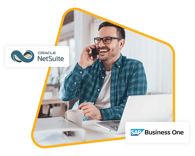 Smiling man on phone at desk, representing ERP support and training services for NetSuite and SAP Business One by ProjectLine.