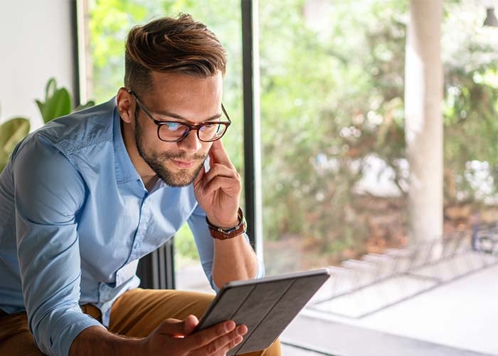 Man reading on a tablet