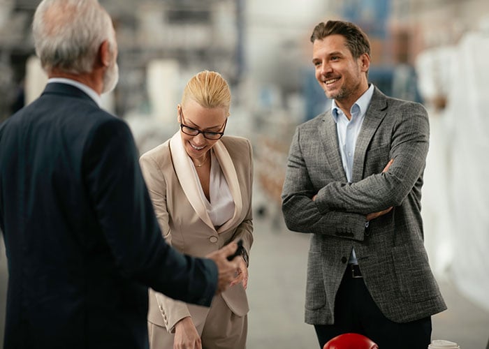 Group of business people on the warehouse floor