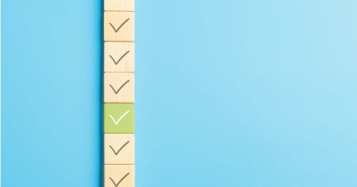 Scrabble tiles with checkmarks - ERP requirements gathering checklist