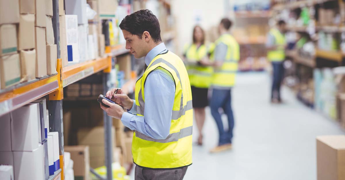 Warehouse worker using a handheld device
