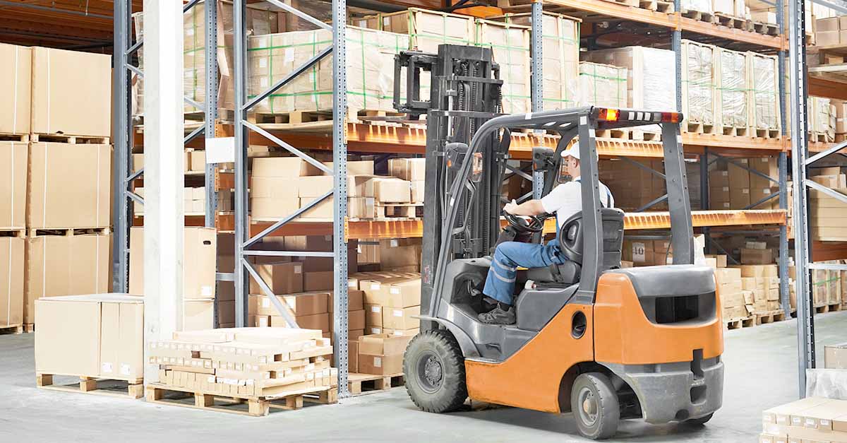 Warehouse worker using a forklift