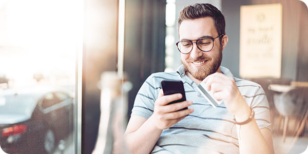 Man making ecommerce purchase on phone