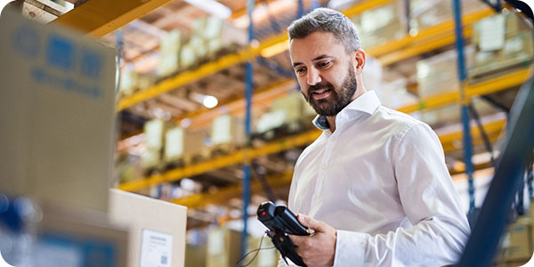 Warehouse worker using a handheld device