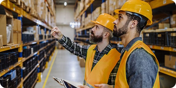 Warehouse workers using a tablet